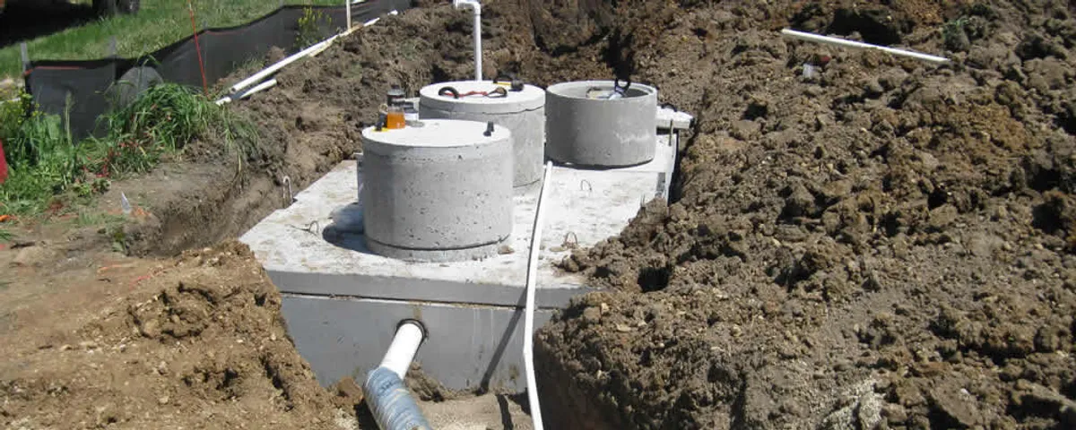 Septic system repair and installation site with tank access ports in Highland Park, IL
