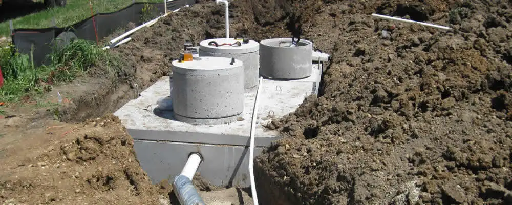 Septic system repair and installation site with tank access ports in Highland Park, IL