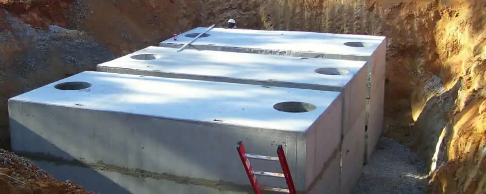 Septic tank installation site with a newly placed concrete tank in Highland Park, IL